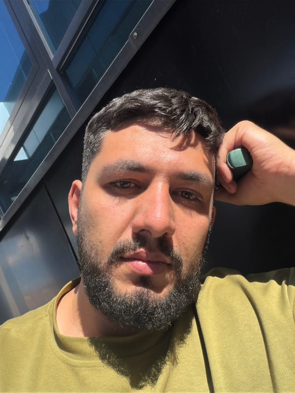 Man uses green device outdoors in Krasnoyarsk