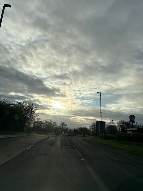 Morning street scene documented in Oswestry under cloudy skies