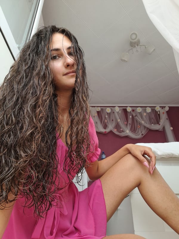 Indoor portrait session in a pink dress, multiple angles.