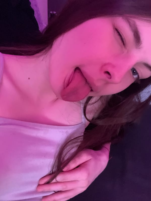 Woman Takes Playful Selfie in Pink Light, Saint Petersburg