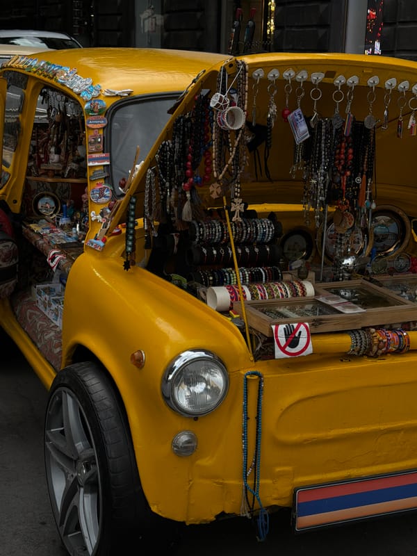 Yellow vintage vehicle operates as mobile stall