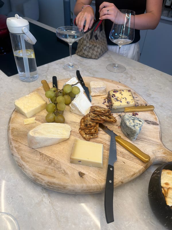 Cheese board and wine spread on a marble countertop in Ridderkerk