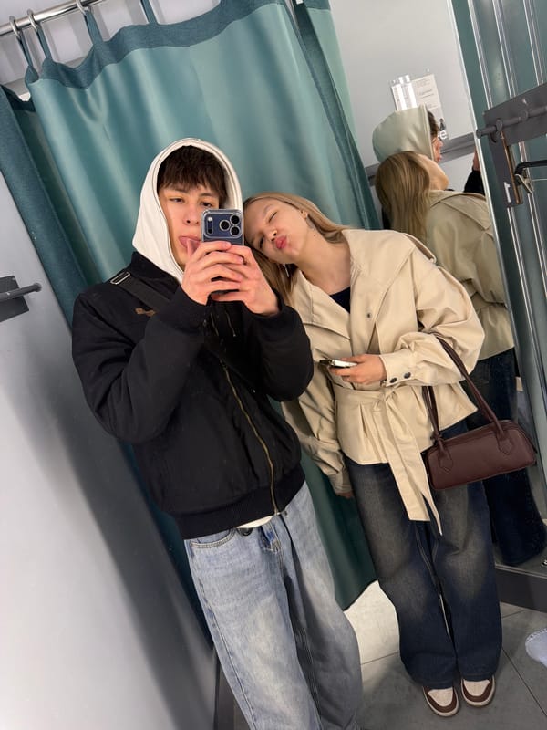 Two youths take mirror selfie in Yekaterinburg fitting room