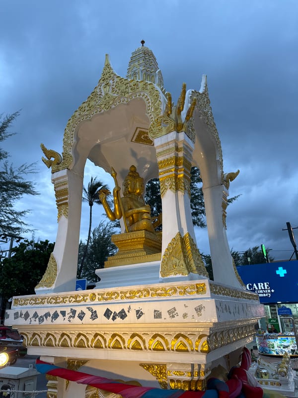 Elaborate gold spirit house shrine on a Patong street