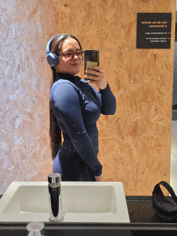 Woman takes selfie in public restroom in Puente Alto