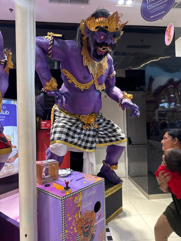Ornate Balinese demon statue draws attention in Kuta terminal