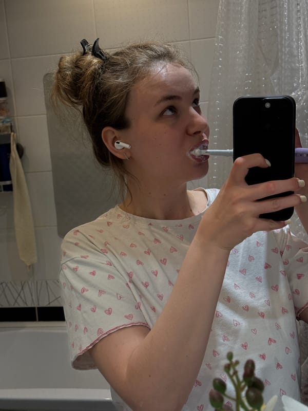 Woman records selfie while brushing teeth in Vladimir bathroom