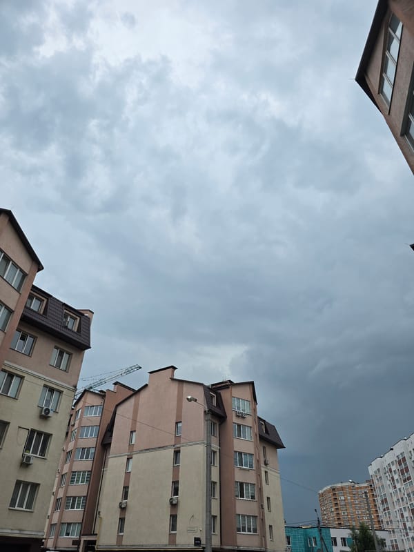 Ordinary life documented across Ukrainian suburb during rainy afternoon