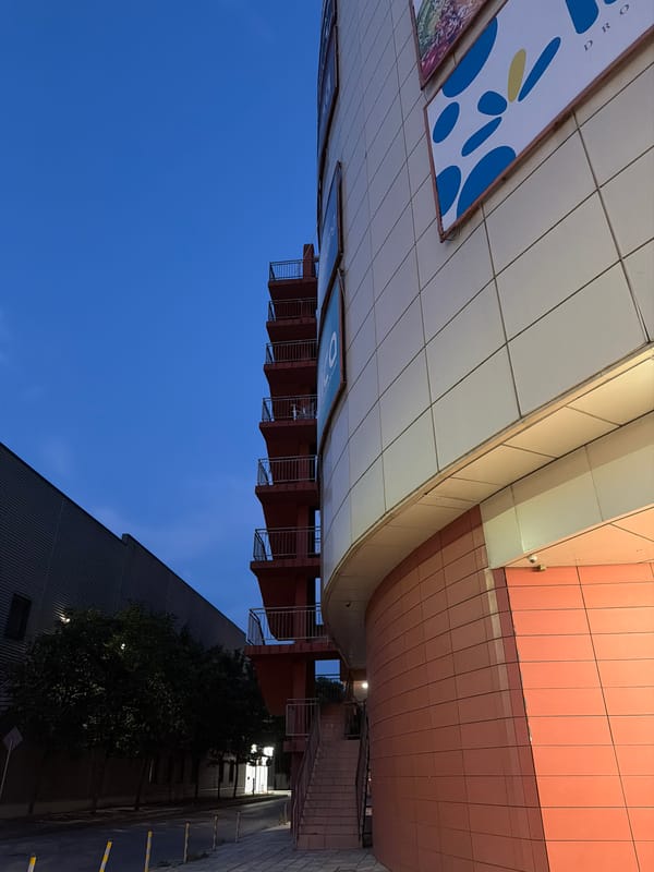 Curved salmon-tiled commercial facade in Varna, Bulgaria