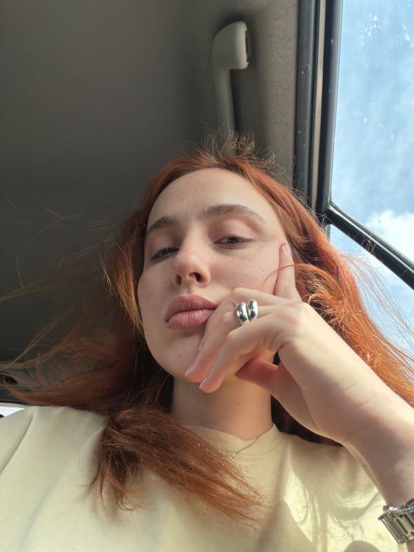 Woman takes car selfies in Tbilisi morning commute