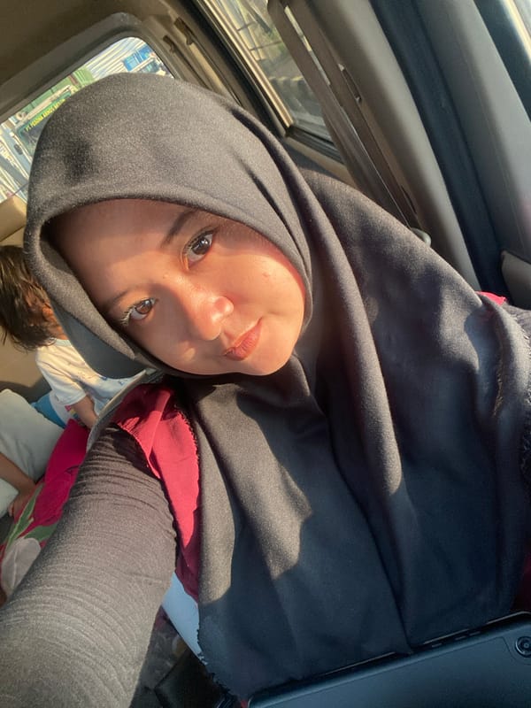 Person in hijab spotted traveling through Bangun, Indonesia