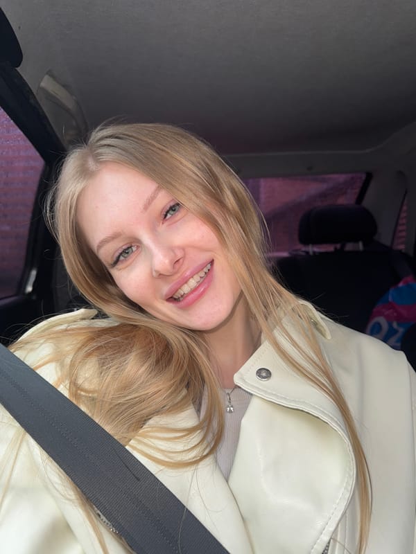 Woman photographed in car with flowers in Perm