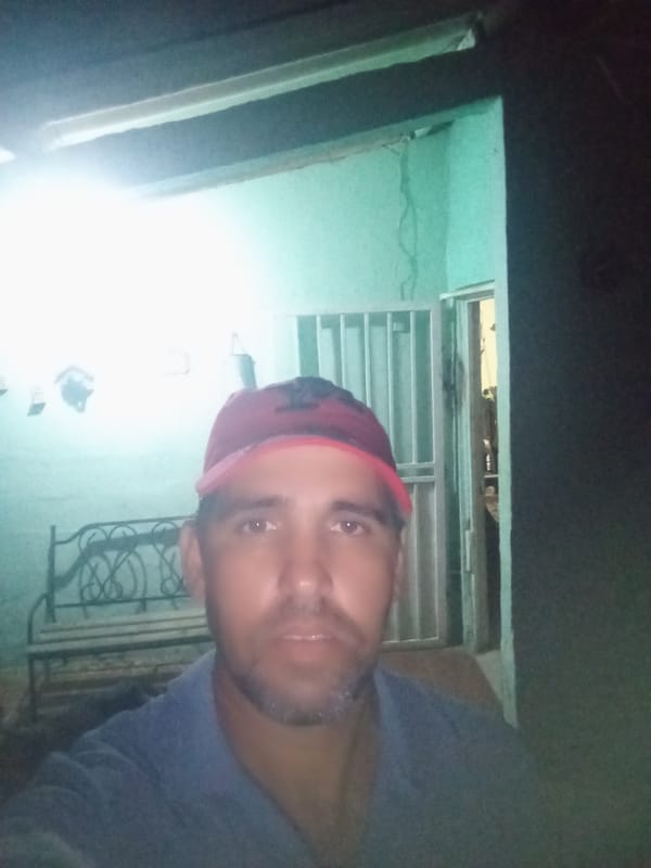 Woman takes selfies on sunny afternoon in Juan Griego