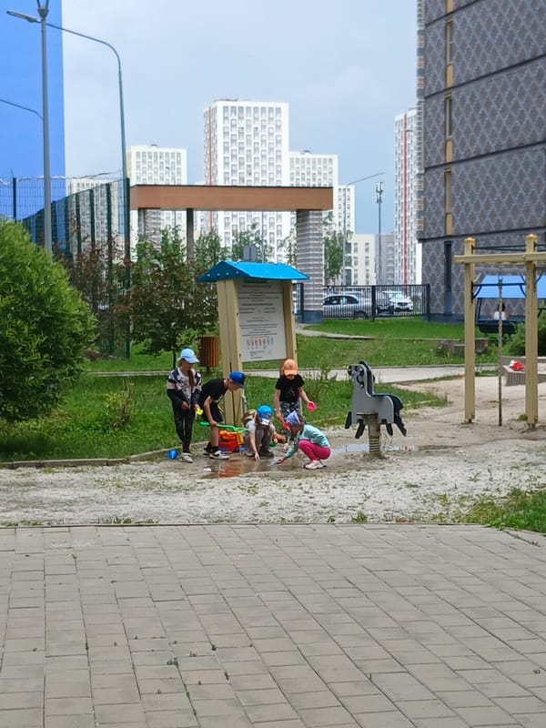Morning playtime at Yekaterinburg residential complex after rain