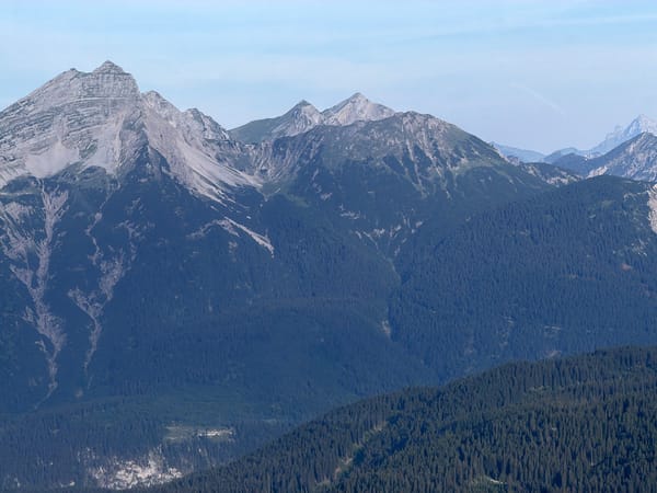 Alpine views above Grainau, forested slopes and cable car