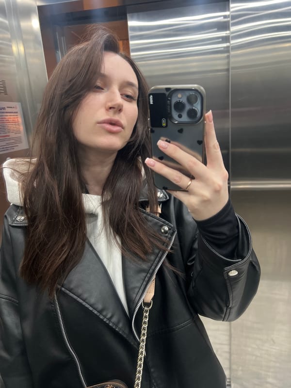 Woman documents cafe visit in Tyumen, Russia