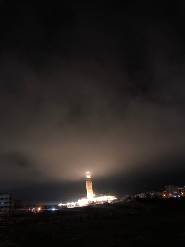 Hassan II Mosque shrouded in nighttime fog, Casablanca