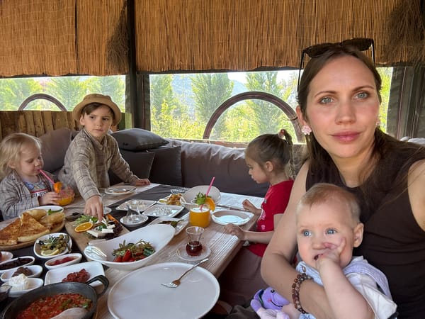 Family enjoys morning breakfast at restaurant in Kaş, Turkey