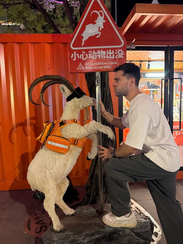 Man observes mountain goat statue in Beijing's Chaoyang District