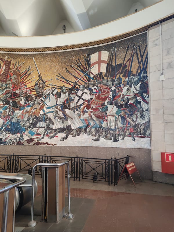 Medieval battle mosaic mural observed in Saint Petersburg building