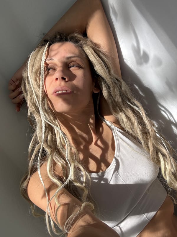 Woman with blonde braids recorded indoors in Russian villages