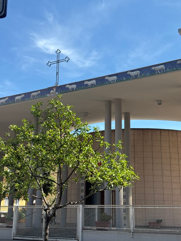 Rome street walk captures church, buildings, poodle near San Clemente