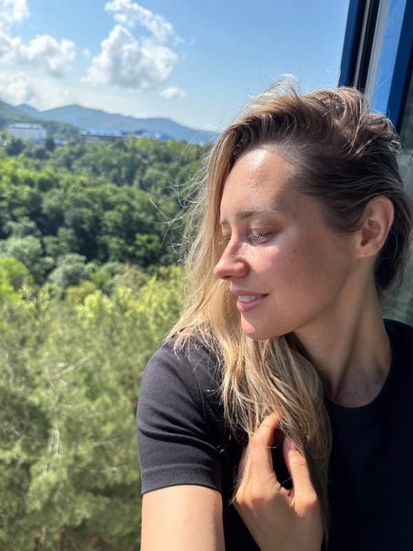 Woman enjoys morning selfie session in coastal Nebug, Russia