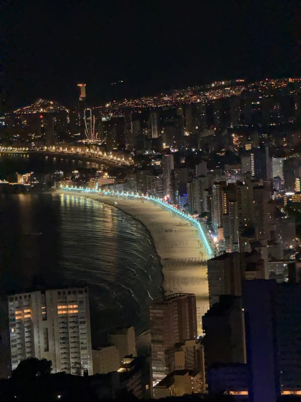 Benidorm's lit-up coastline viewed from the hills at night