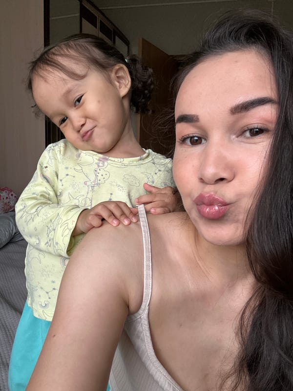 Mother and child share playful selfie session in Uray