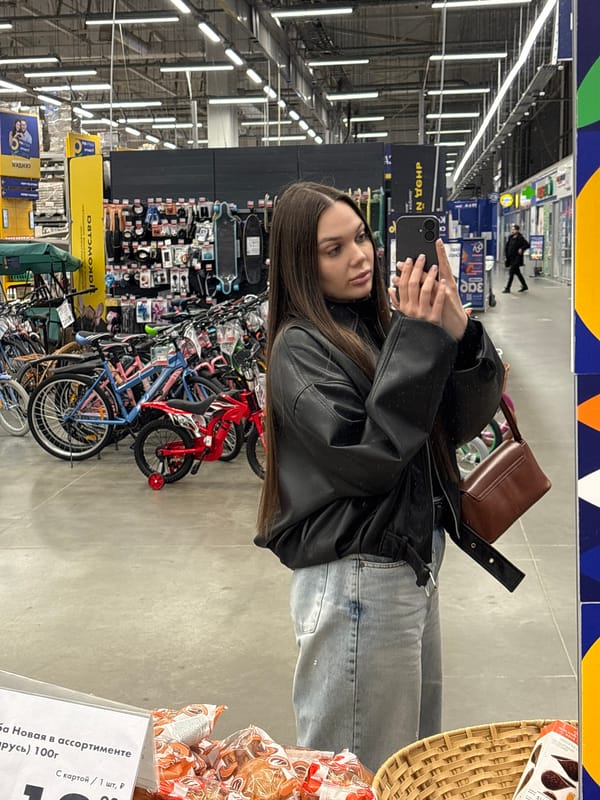 Woman takes mirror selfie in Yekaterinburg retail store