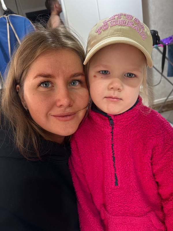 Woman and girl share moment in rural Russia