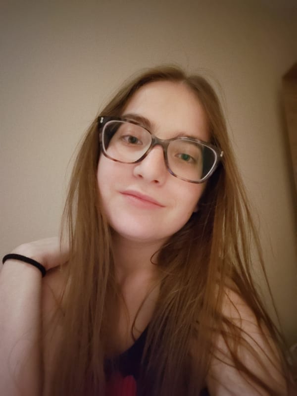 Woman takes selfies indoors in Sofia, Bulgaria