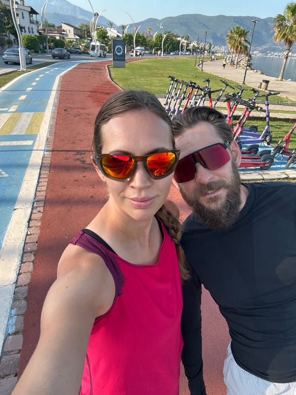Couple takes early morning selfie near scooters in Fethiye