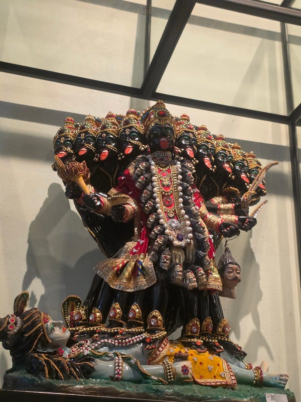 Visitor documents Thai cultural museum exhibits in Bangkok