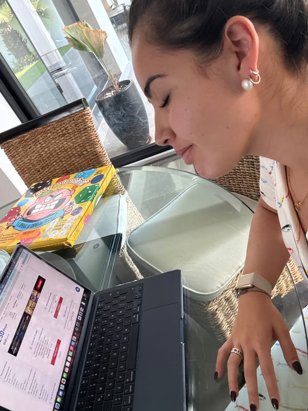 Person uses MacBook to browse Telmex website in Mexico