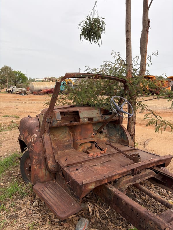 Scrap metal collection operation at Nigerian vehicle graveyard