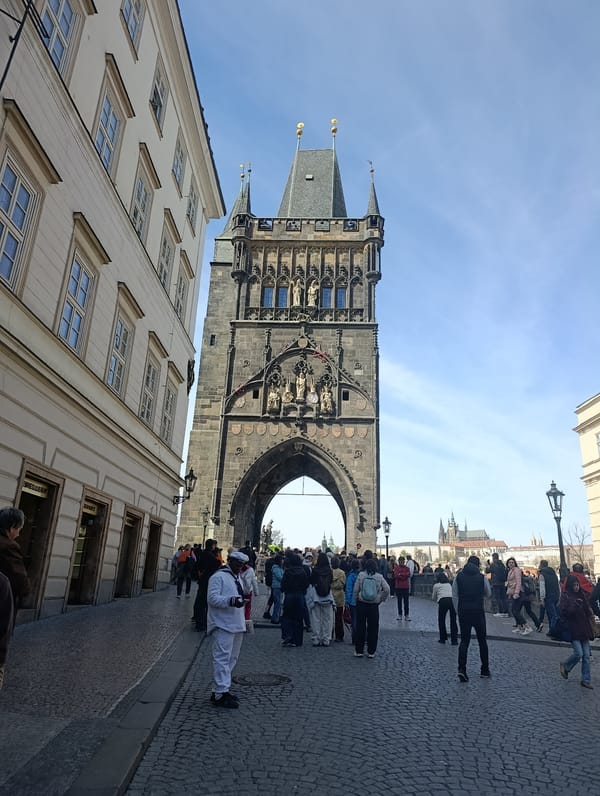 Historic Powder Tower documented in Prague with pedestrian activity