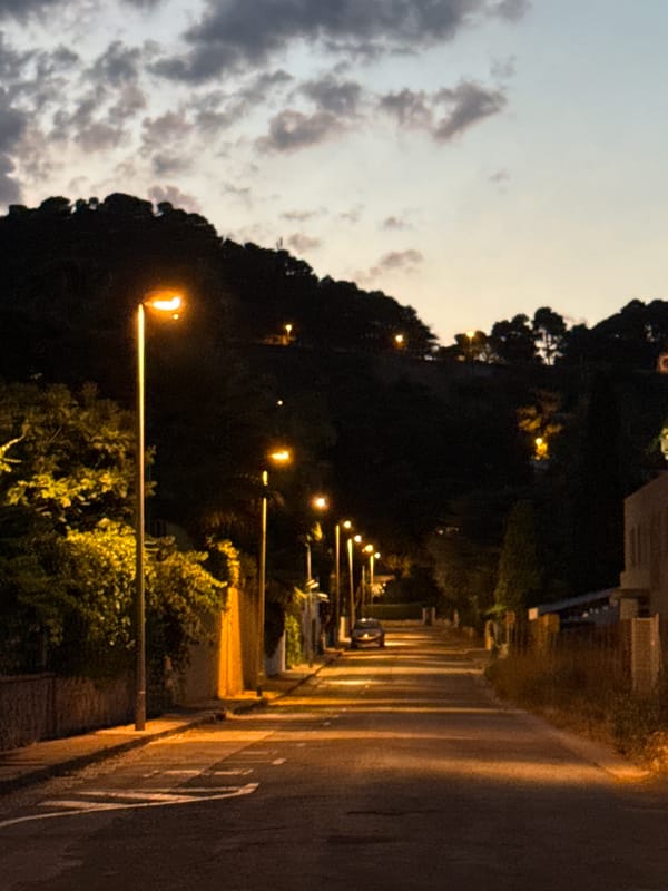 Dusk settles over a quiet street in Blanes