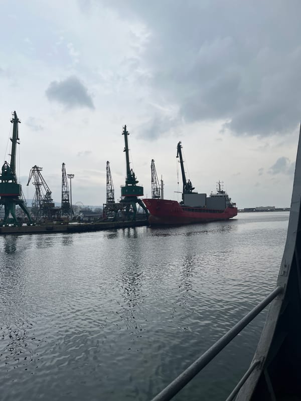 Cargo ship docked at Varna port under cloudy skies