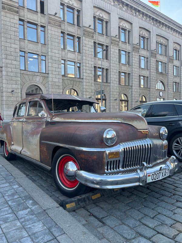 Vintage car and metro crowd captured in Minsk
