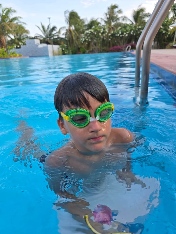 Children swimming at Phu Thuy Ward pool Vietnam