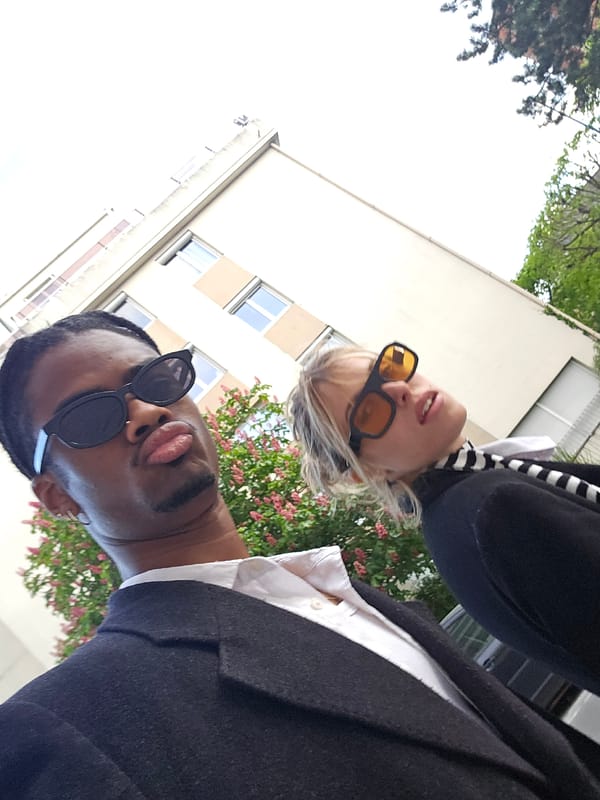 Two people photographed in Pantin elevator and outdoors Sunday