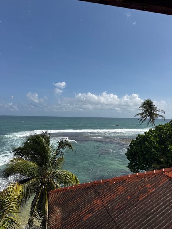 Morning on the Sri Lankan coast: rain, fishing boats, and a meal