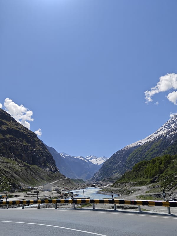 Mountain highway and river documented in northern India valley
