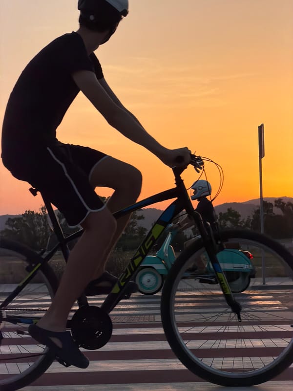 Golden hour on the Castelló coast: beach, bikes, and ships