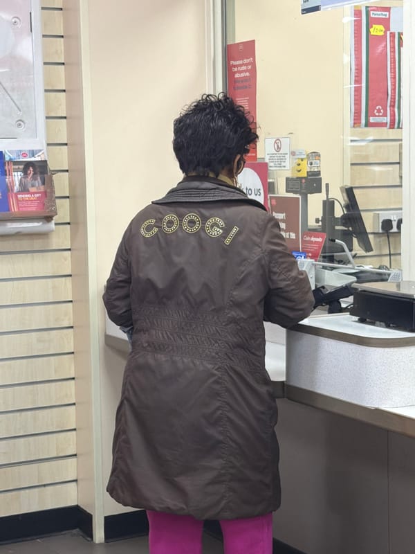 Woman in distinctive jacket visits London post office