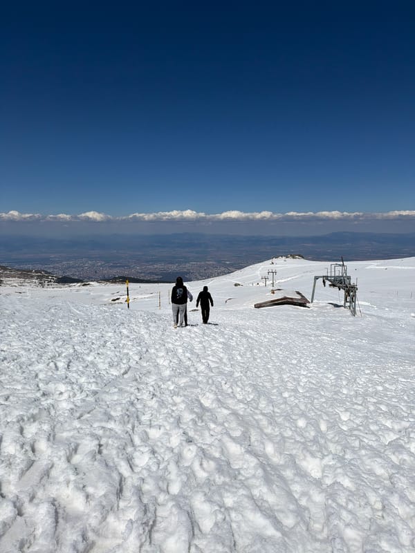 Winter visitors gather on snowy mountain above Bistritsa