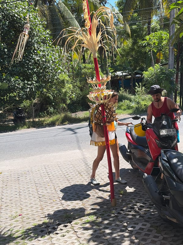 Roadside moment with a red motorcycle in Nusa Penida