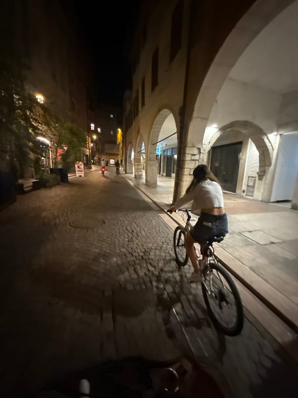 Late-night bike ride through Trento's cobblestone streets