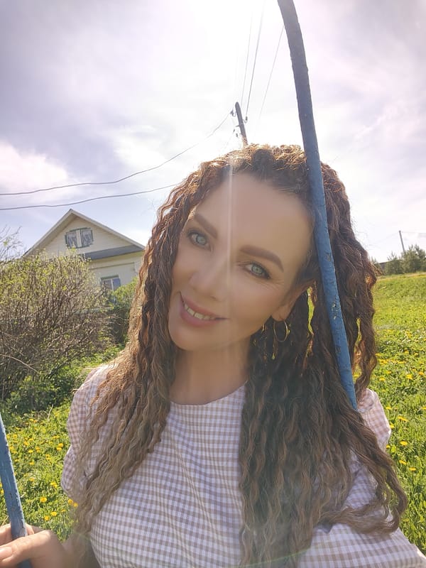 Woman in checkered dress documents dandelion picking and rural moments